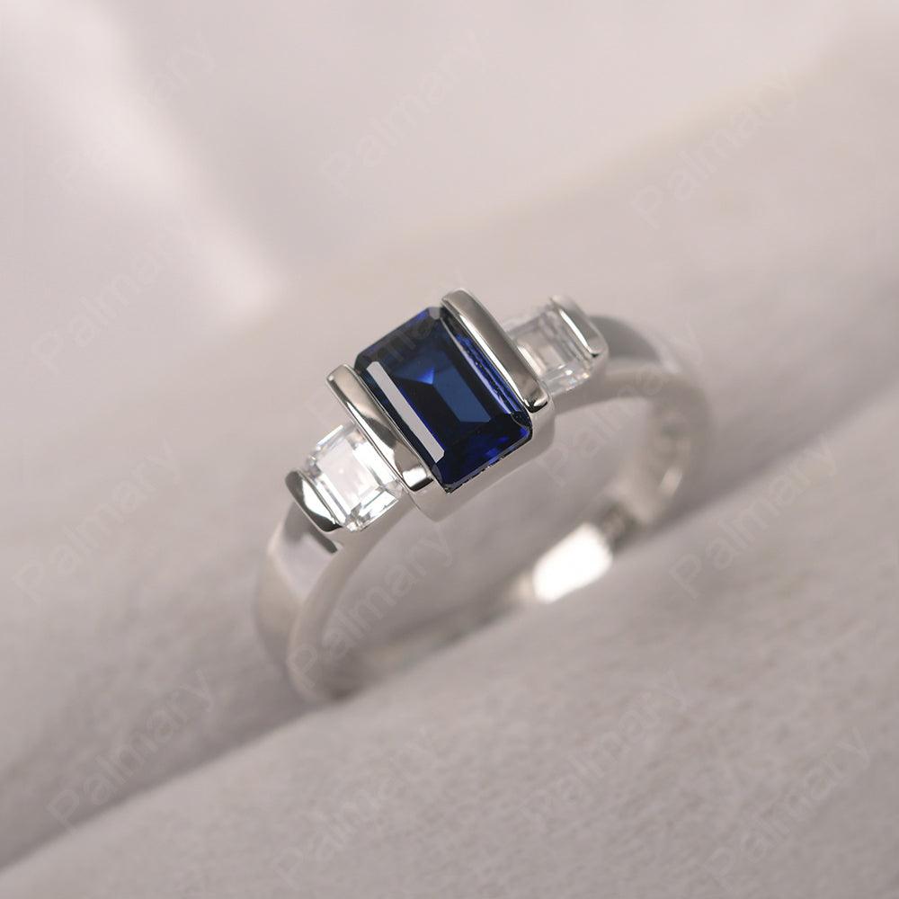 Three Stone Emerald Cut Sapphire Rings - Palmary