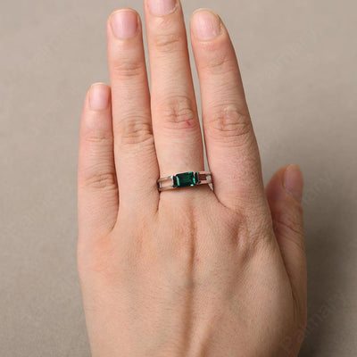 East West Emerald Cut Emerald Solitaire Ring - Palmary