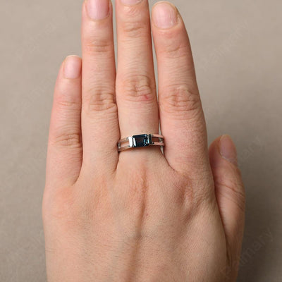 East West Emerald Cut London Blue Topaz Solitaire Ring - Palmary