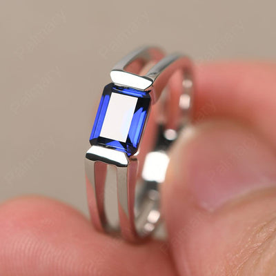 East West Emerald Cut Sapphire Solitaire Ring - Palmary
