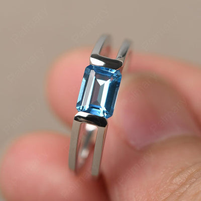 East West Emerald Cut Swiss Blue Topaz Solitaire Ring - Palmary
