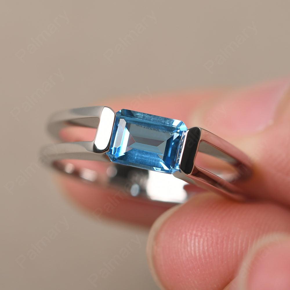 East West Emerald Cut Swiss Blue Topaz Solitaire Ring - Palmary