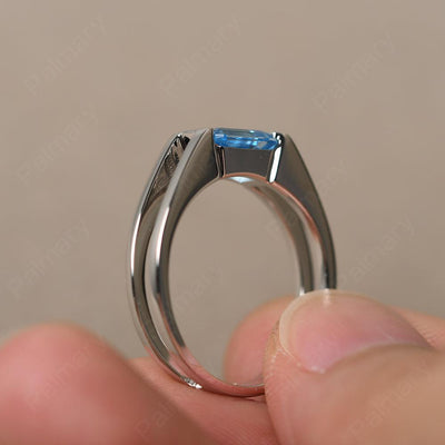 East West Emerald Cut Swiss Blue Topaz Solitaire Ring - Palmary