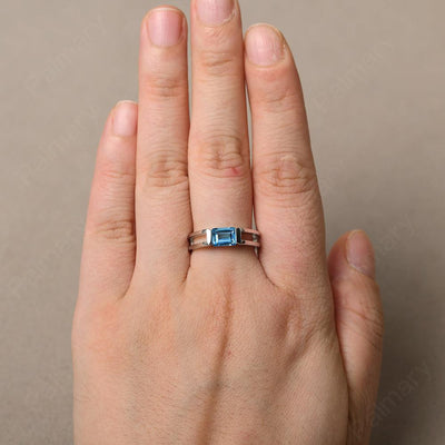 East West Emerald Cut Swiss Blue Topaz Solitaire Ring - Palmary