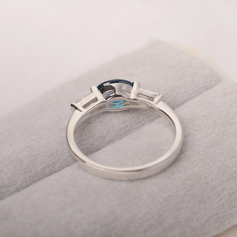 East West Oval London Blue Topaz Engagement Ring - Palmary