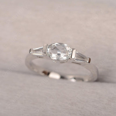 East West Oval White Topaz Engagement Ring - Palmary
