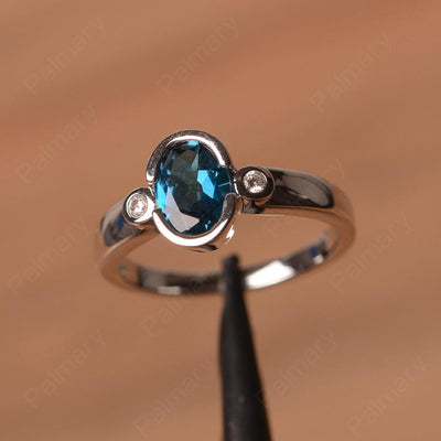 Oval London Blue Topaz Bezel Engagement Rings - Palmary