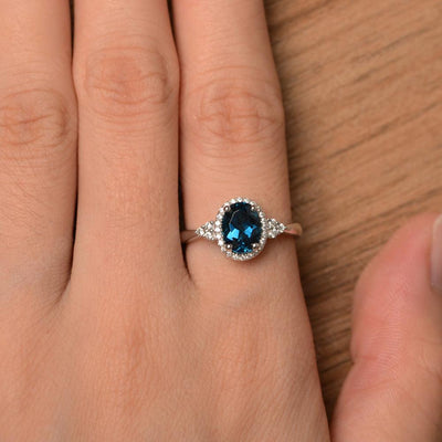 Oval Cut London Blue Topaz Halo Engagement Rings - Palmary