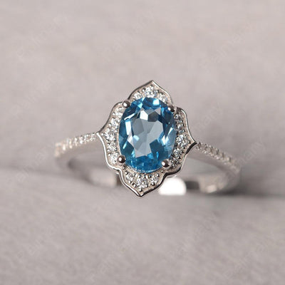 Oval Cut Petal Swiss Blue Topaz Engagement Ring - Palmary