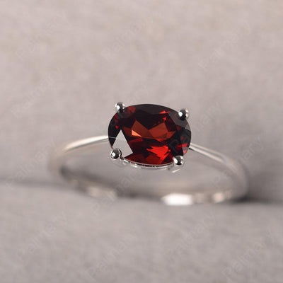 East West Oval Cut Garnet Solitaire Ring - Palmary