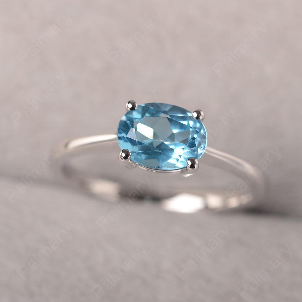 East West Oval Cut Swiss Blue Topaz Solitaire Ring - Palmary