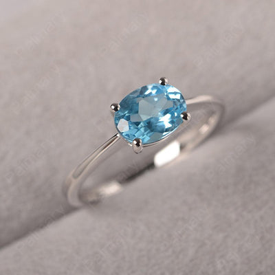East West Oval Cut Swiss Blue Topaz Solitaire Ring - Palmary