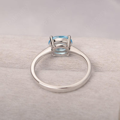 East West Oval Cut Swiss Blue Topaz Solitaire Ring - Palmary