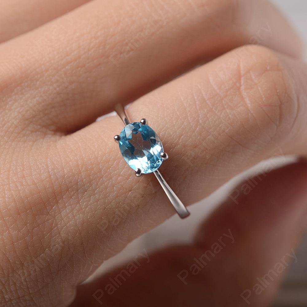 East West Oval Cut Swiss Blue Topaz Solitaire Ring - Palmary