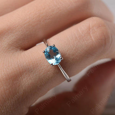 East West Oval Cut Swiss Blue Topaz Solitaire Ring - Palmary