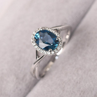 Oval Shaped London Blue Topaz Halo Engagement Ring - Palmary