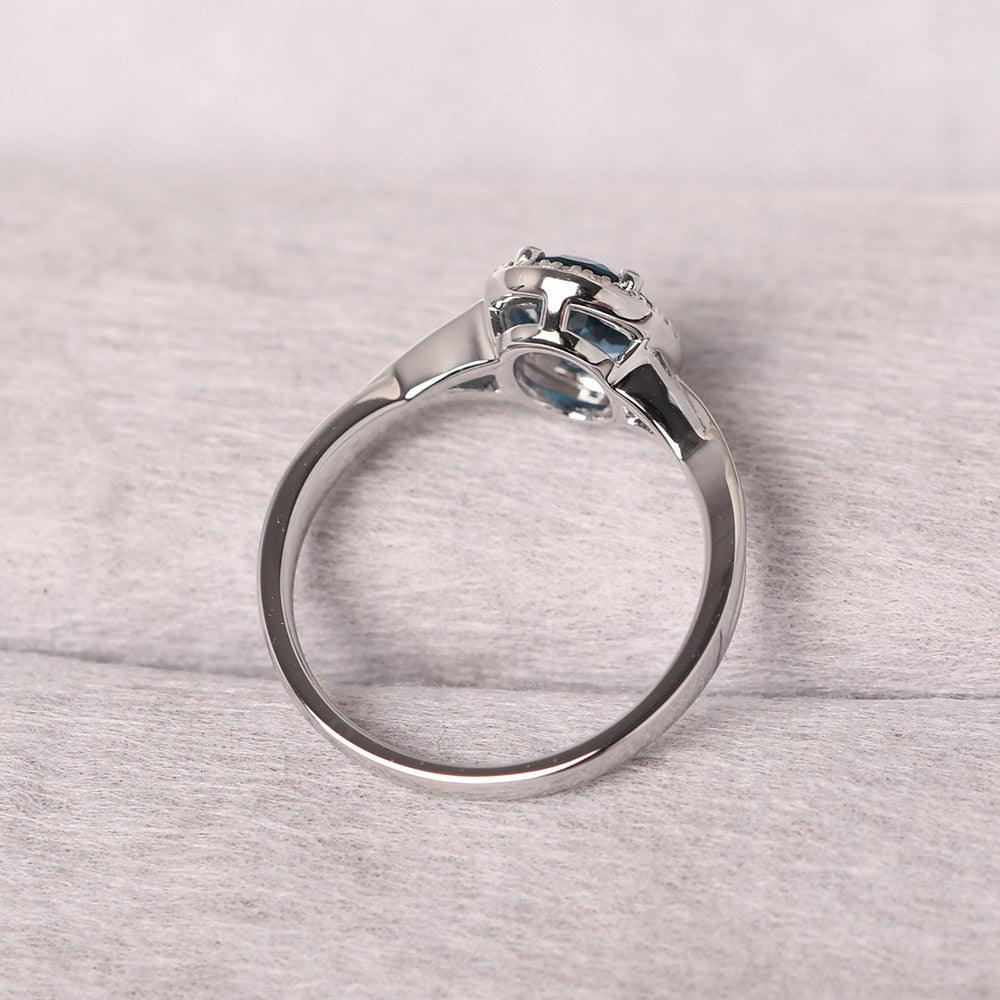 Oval Shaped London Blue Topaz Halo Engagement Ring - Palmary