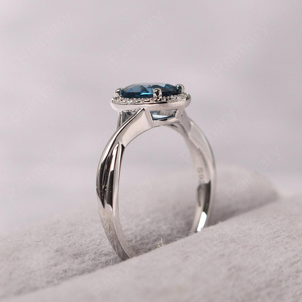 Oval Shaped London Blue Topaz Halo Engagement Ring - Palmary