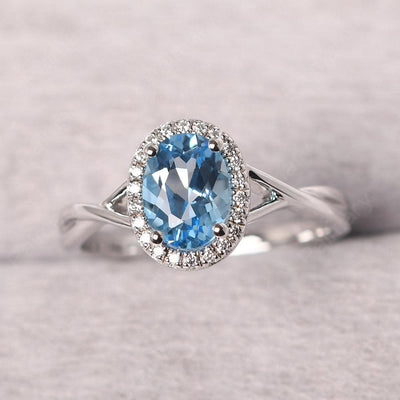 Oval Shaped Swiss Blue Topaz Halo Engagement Ring - Palmary