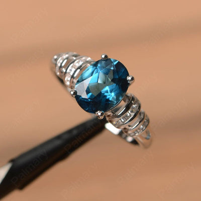 Oval Shaped London Blue Topaz Engagement Rings - Palmary