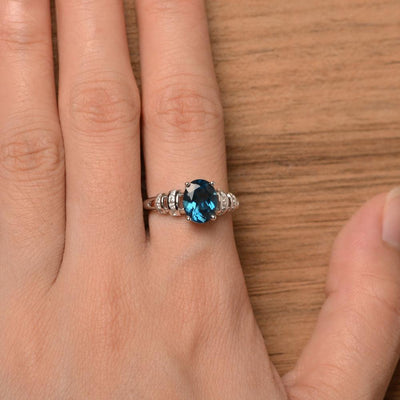 Oval Shaped London Blue Topaz Engagement Rings - Palmary