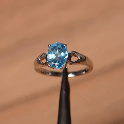 Oval Swiss Blue Topaz Ring With Heart On Band - Palmary