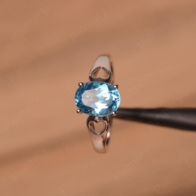 Oval Swiss Blue Topaz Ring With Heart On Band - Palmary