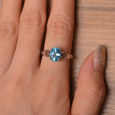 Oval Swiss Blue Topaz Ring With Heart On Band - Palmary
