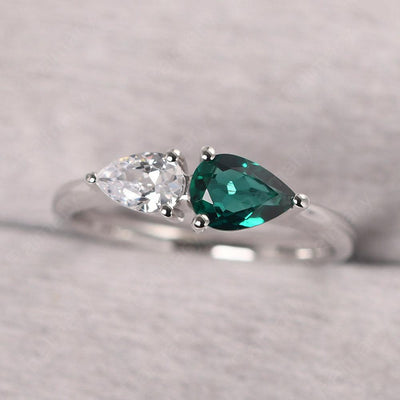 East West Pear Shaped Cubic Zirconia And Emerald Two Stone Ring - Palmary