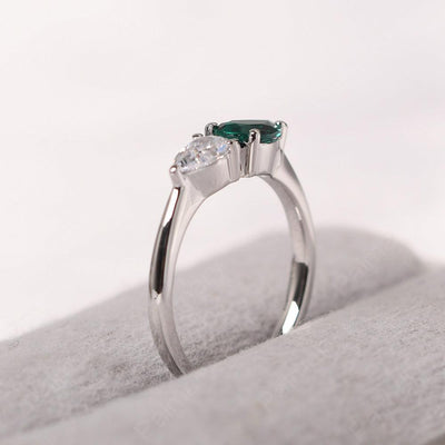 East West Pear Shaped Cubic Zirconia And Emerald Two Stone Ring - Palmary