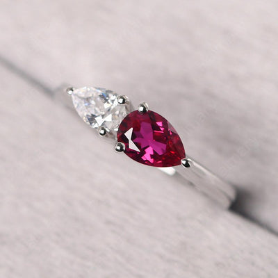 East West Pear Shaped Cubic Zirconia And Ruby Two Stone Ring - Palmary