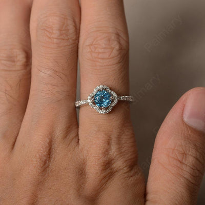 Round Cut Classics Swiss Blue Topaz Halo Rings - Palmary