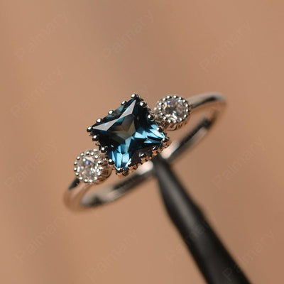 Three Stone London Blue Topaz Engagement Rings - Palmary