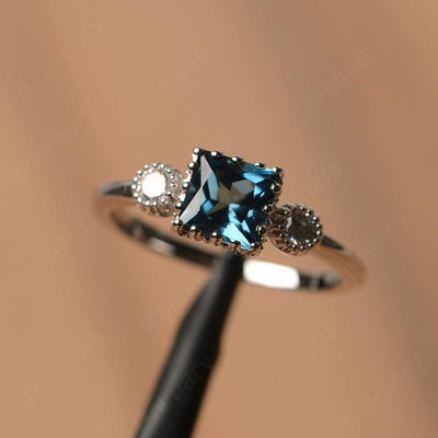 Three Stone London Blue Topaz Engagement Rings - Palmary