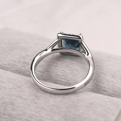 Twisted Princess Cut London Blue Topaz Halo Ring - Palmary